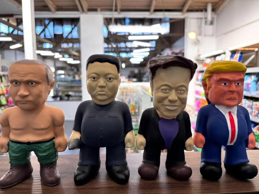 Four novelty chew toys of political figures on a shelf in Pets of Sandgate store.