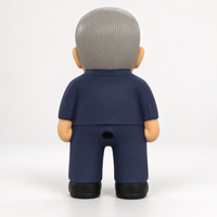 Rear view of the MEGA Anthony Albanese dog toy showing molded grey hair, navy suit and black shoes.