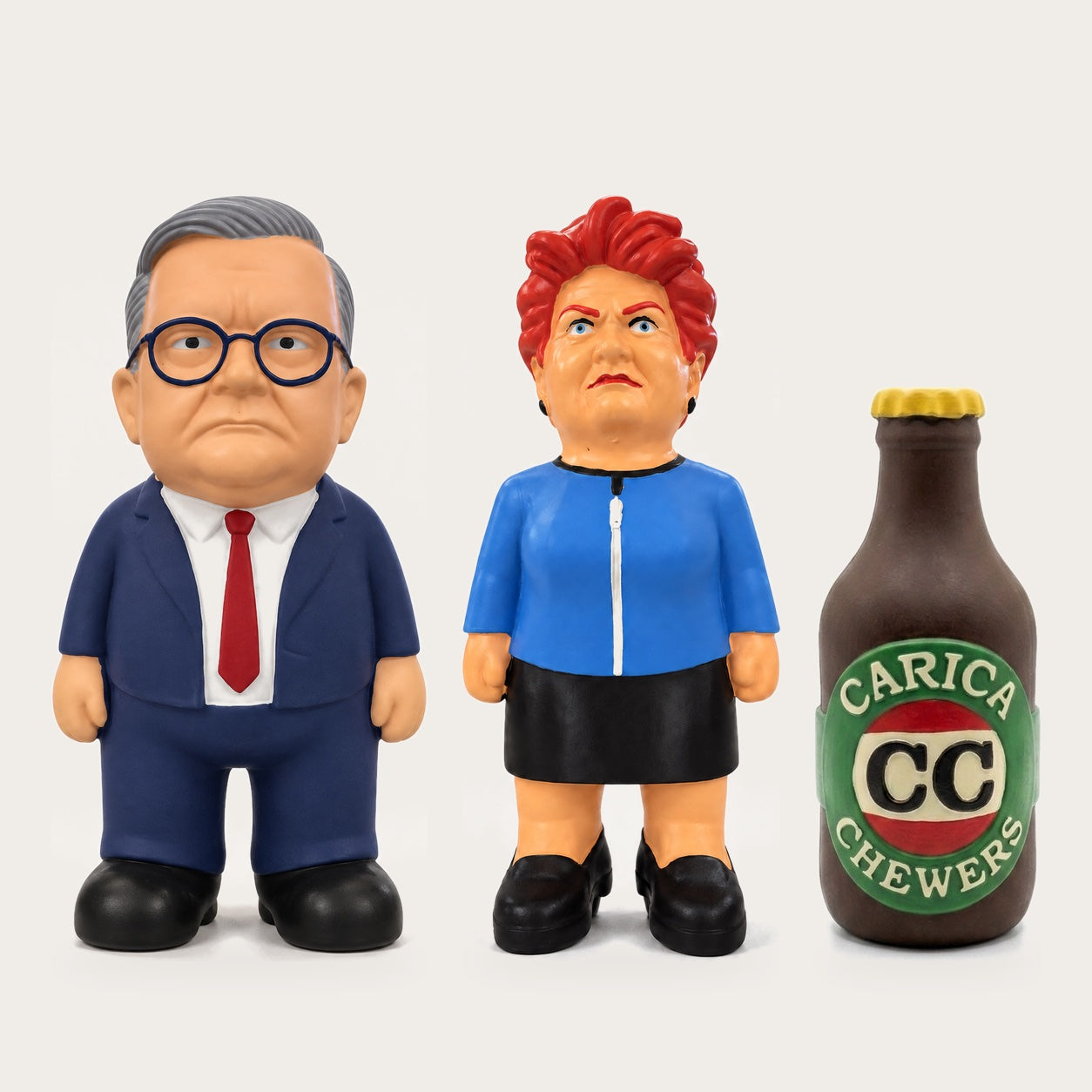 Large Anthony Albanese dog toy, large Pauline Hanson dog toy and Carica Chewers CC Long Neck beer bottle dog toy side by side